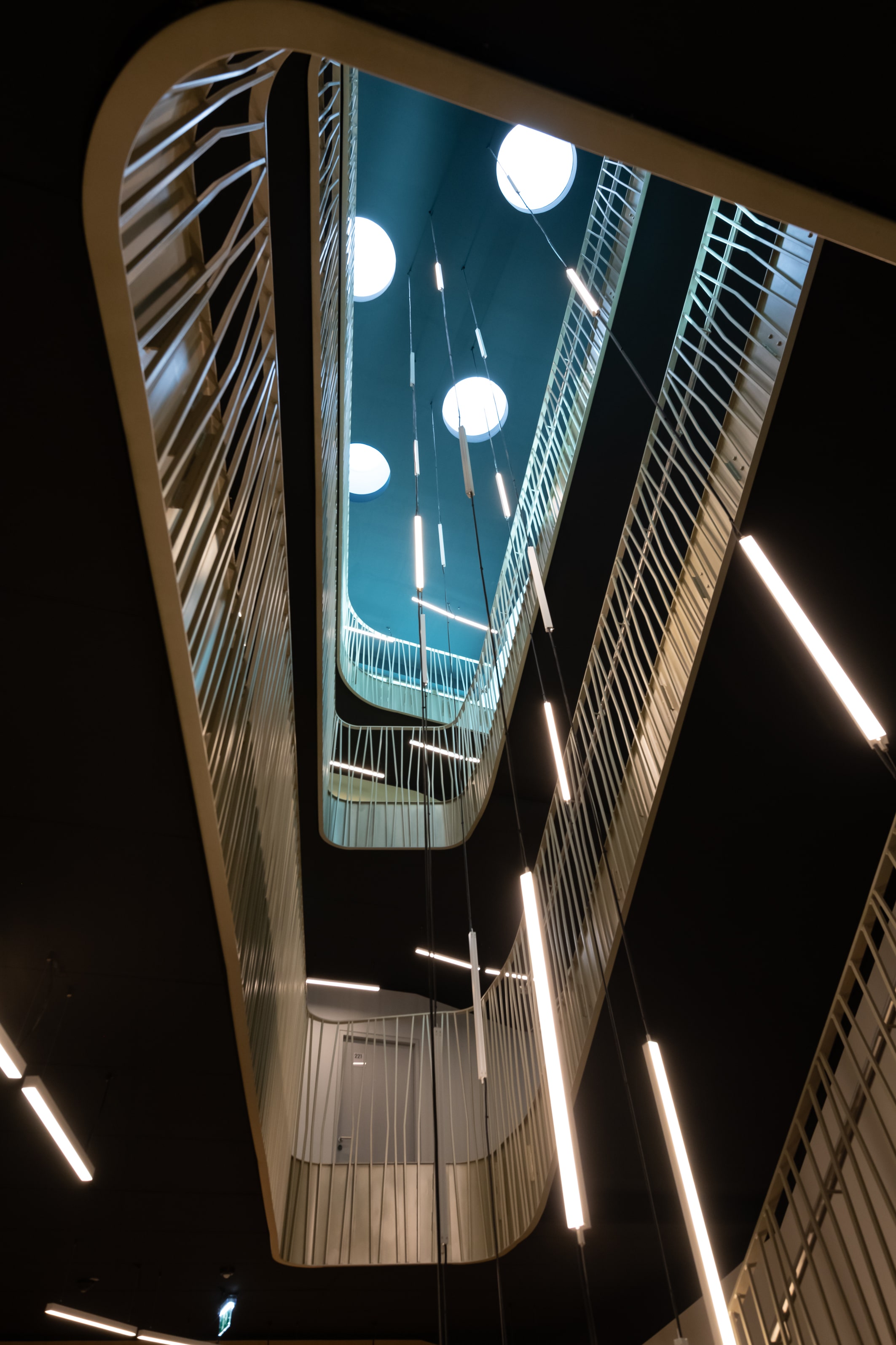 Modern design in the atrium  Architecturally impressive atrium with stylish lighting and futuristic design